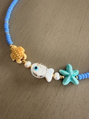 Blue Beaded Sea Life Necklace with Turquoise Starfish and Yellow Turtle